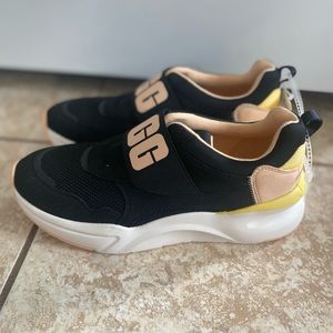 Brand new logo-print slip-on sneakers
Black/peach/white suede logo-print slip-on